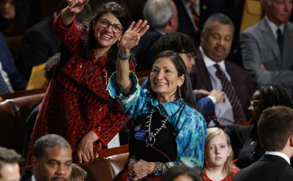 Rep. Rashida Tlaib (left) and Rep. Deb Haaland look up to the gallery at the U.S. Capitol on Thursday, their first day as members of Congress. Rep. Rashida Tlaib (left) and Rep. Deb Haaland look up to the gallery at the U.S. Capitol on Thursday, their first day as members of Congress.