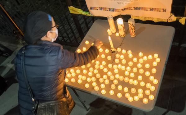The U.S. death toll from COVID-19 hit a new milestone, surpassing the number of Americans who died in the prolonged conflict with Vietnam. Here, the Elmhurst Hospital Center in Queens, N.Y., holds a vigil for medical workers and patients who have died in The U.S. death toll from COVID-19 hit a new milestone, surpassing the number of Americans who died in the prolonged conflict with Vietnam. Here, the Elmhurst Hospital Center in Queens, N.Y., holds a vigil for medical workers and patients who have died in