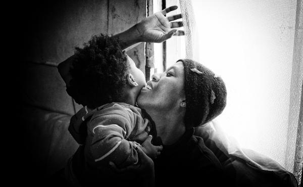 Clara, 27, plays with her son. Both of them are HIV-positive and have had TB; they live in South Africa. Clara, 27, plays with her son. Both of them are HIV-positive and have had TB; they live in South Africa.