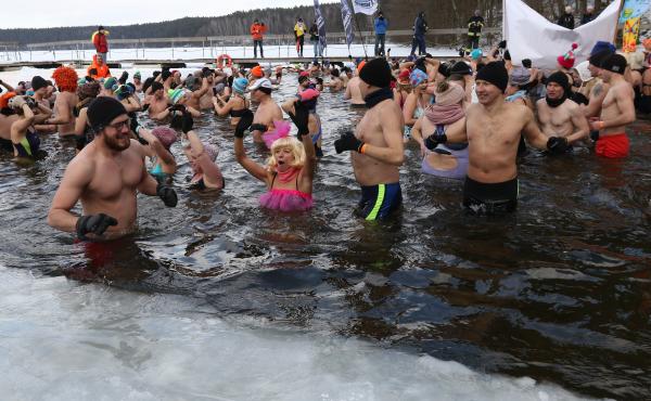 Winter swimmers enjoyed an icy dip in Poland's Garczyn lake last February. Recorded air temperature was around 14 degrees Farenheit, and a large ice hole had to be cut to allow the lake bathing. Winter swimmers enjoyed an icy dip in Poland's Garczyn lake last February. Recorded air temperature was around 14 degrees Farenheit, and a large ice hole had to be cut to allow the lake bathing.