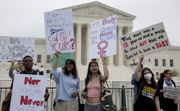 Abortion-rights supporters demonstrate in front of the Supreme Court on Wednesday in Washington, D.C. Abortion-rights supporters demonstrate in front of the Supreme Court on Wednesday in Washington, D.C.
