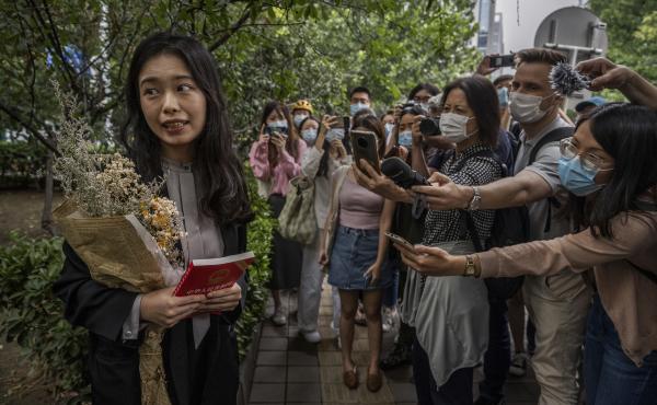 Zhou Xiaoxuan speaks to journalists and supporters on Sept. 14 outside the Haidian District People's Court in Beijing before a hearing in her case. She alleged that she was groped and forcibly kissed by prominent TV anchor Zhu Jun, who denies the allegati Zhou Xiaoxuan speaks to journalists and supporters on Sept. 14 outside the Haidian District People's Court in Beijing before a hearing in her case. She alleged that she was groped and forcibly kissed by prominent TV anchor Zhu Jun, who denies the allegati
