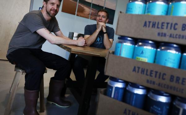 Athletic Brewing Co. co-founders Bill Shufelt (right) and John Walker, here at the company's production plant in Stratford, Conn., have created a range of high-quality nonalcoholic beers to provide people more options when they're out socializing. Athletic Brewing Co. co-founders Bill Shufelt (right) and John Walker, here at the company's production plant in Stratford, Conn., have created a range of high-quality nonalcoholic beers to provide people more options when they're out socializing.