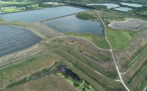 A leak at the reservoir at Piney Point, an old phosphate plant in Manatee County, Fla., as shown in an aerial photo on Saturday, has prompted evacuations, environmental concerns and threats of a full-fledged breach. A leak at the reservoir at Piney Point, an old phosphate plant in Manatee County, Fla., as shown in an aerial photo on Saturday, has prompted evacuations, environmental concerns and threats of a full-fledged breach.