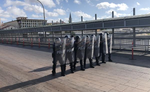 A special response team with Customs and Border Protection drills on the international bridge between Laredo, Texas, and Nuevo Laredo, Mexico, in the event that desperate migrants rush the port of entry. A special response team with Customs and Border Protection drills on the international bridge between Laredo, Texas, and Nuevo Laredo, Mexico, in the event that desperate migrants rush the port of entry.