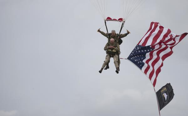 U.S. World War II D-Day veteran Tom Rice, from Coronado, Calif., parachutes in a tandem jump into a field in Carentan, Normandy, France, on Wednesday. Approximately 200 parachutists participated in the event, replicating a jump made by U.S. soldiers on Ju U.S. World War II D-Day veteran Tom Rice, from Coronado, Calif., parachutes in a tandem jump into a field in Carentan, Normandy, France, on Wednesday. Approximately 200 parachutists participated in the event, replicating a jump made by U.S. soldiers on Ju