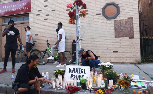 A memorial, pictured in Sept. 2020, commemorated the site where Daniel Prude was arrested in Rochester, N.Y. Prude died of asphyxiation after being restrained by police in March, and his family has filed a wrongful death lawsuit nearly a year later. A memorial, pictured in Sept. 2020, commemorated the site where Daniel Prude was arrested in Rochester, N.Y. Prude died of asphyxiation after being restrained by police in March, and his family has filed a wrongful death lawsuit nearly a year later.