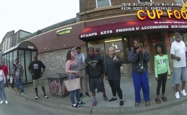 A police body camera image shows bystanders including Darnella Frazier (third from right filming) as former Minneapolis police officer Derek Chauvin was recorded pressing his knee on George Floyd's neck in Minneapolis. A police body camera image shows bystanders including Darnella Frazier (third from right filming) as former Minneapolis police officer Derek Chauvin was recorded pressing his knee on George Floyd's neck in Minneapolis.