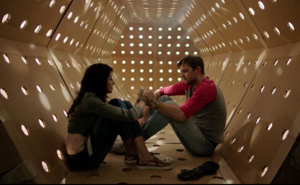 A Corrugated Community: Annie (Meera Rohit Kumbhani) and Dave (Nick Thune) in the Kubrick Corridor — an attraction of Dave's Maze. A Corrugated Community: Annie (Meera Rohit Kumbhani) and Dave (Nick Thune) in the Kubrick Corridor — an attraction of Dave's Maze.