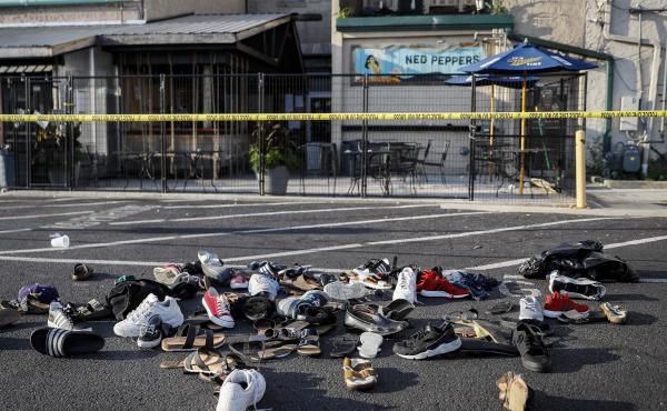 Shoes of victims are piled at the scene of Sunday's mass shooting in Dayton, Ohio. Shoes of victims are piled at the scene of Sunday's mass shooting in Dayton, Ohio.
