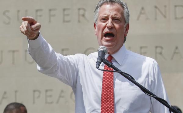 New York City Mayor Bill de Blasio, shown here at an event last month, defended the move to shift funds away from the city's police department. New York City Mayor Bill de Blasio, shown here at an event last month, defended the move to shift funds away from the city's police department.