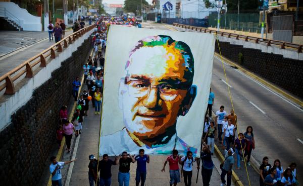 Catholics march in San Salvador on March 22, 2014, during the commemoration of the 33th anniversary of Romero's murder. Catholics march in San Salvador on March 22, 2014, during the commemoration of the 33th anniversary of Romero's murder.