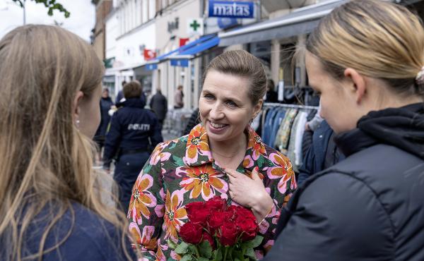 Denmark's Prime Minister Mette Frederiksen, center, speaks to people while on an election campaign, in Holbaek, Denmark, Saturday, May 28, 2022. Denmark's Prime Minister Mette Frederiksen, center, speaks to people while on an election campaign, in Holbaek, Denmark, Saturday, May 28, 2022.
