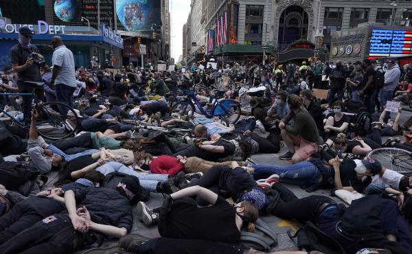 Protesters lie on the ground with their hands behind their backs in New York City's Times Square on Monday. Outrage over police brutality and systemic racism has spilled into the streets in cities across the country. Protesters lie on the ground with their hands behind their backs in New York City's Times Square on Monday. Outrage over police brutality and systemic racism has spilled into the streets in cities across the country.
