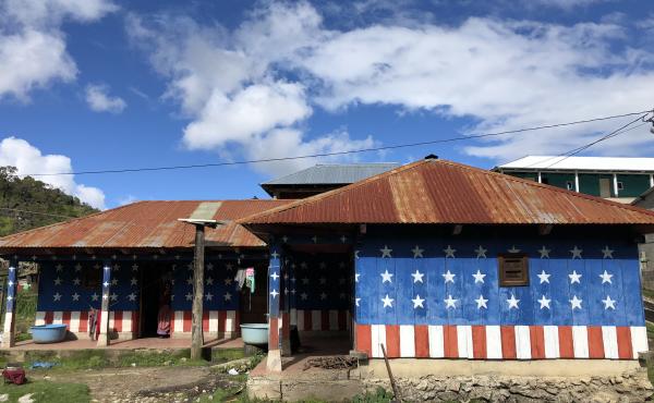 In the village of Quilin Novillo, the houses are billboards for the American dream. One is painted red, white and blue, with stars and stripes. In the village of Quilin Novillo, the houses are billboards for the American dream. One is painted red, white and blue, with stars and stripes.