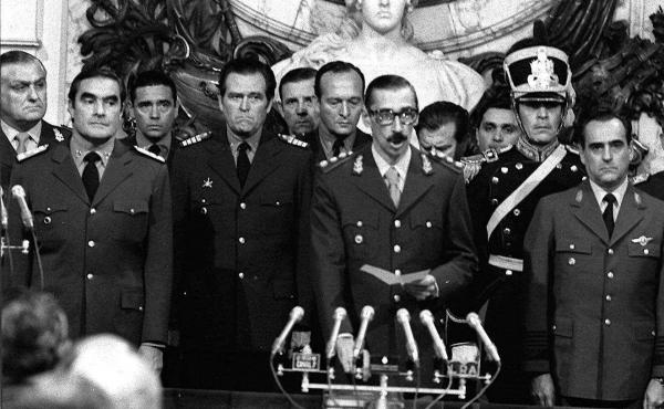 Gen. Jorge Rafael Videla (center) was sworn in as Argentina's president on March 24, 1976, after the overthrow of President Isabel Peron in a coup. Gen. Jorge Rafael Videla (center) was sworn in as Argentina's president on March 24, 1976, after the overthrow of President Isabel Peron in a coup.