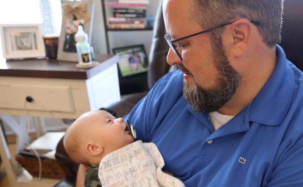 Scott Baisley holds his son Sullivan, who was delivered shortly before his mother died of COVID-19. Scott Baisley holds his son Sullivan, who was delivered shortly before his mother died of COVID-19.