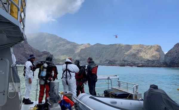Divers near New Zealand's White Island search for a body after the volcanic eruption earlier this week. Divers near New Zealand's White Island search for a body after the volcanic eruption earlier this week.