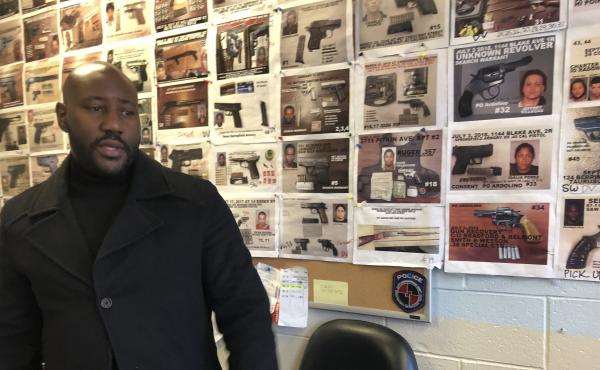New York police Sgt. Damon Martin in the 75th Precinct field intelligence office, where the walls are covered with photos of seized illegal guns. New York police Sgt. Damon Martin in the 75th Precinct field intelligence office, where the walls are covered with photos of seized illegal guns.