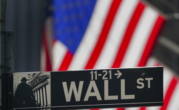 The U.S. flag hangs outside the New York Stock Exchange earlier this month. Investors have been grappling with a wave of uncertainty that's sent the market lower in recent weeks. The U.S. flag hangs outside the New York Stock Exchange earlier this month. Investors have been grappling with a wave of uncertainty that's sent the market lower in recent weeks.