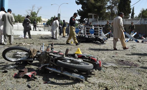 Pakistani security officials inspect the site of an explosion in Quetta on Friday. All told, dozens of people were killed Friday in several cities across Pakistan. Pakistani security officials inspect the site of an explosion in Quetta on Friday. All told, dozens of people were killed Friday in several cities across Pakistan.