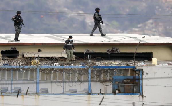 Police walk on the roof of the Litoral Penitentiary on Saturday after riots broke out inside the jail in Guayaquil, Ecuador. Police walk on the roof of the Litoral Penitentiary on Saturday after riots broke out inside the jail in Guayaquil, Ecuador.