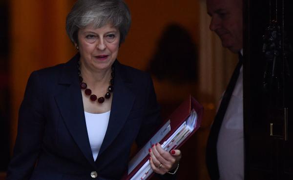 British Prime Minister Theresa May leaves No. 10 Downing Street in London on Wednesday. Now that May has reached an agreement with European Union negotiators, she faces still another difficult task: persuading skeptical Brits to get on board. British Prime Minister Theresa May leaves No. 10 Downing Street in London on Wednesday. Now that May has reached an agreement with European Union negotiators, she faces still another difficult task: persuading skeptical Brits to get on board.