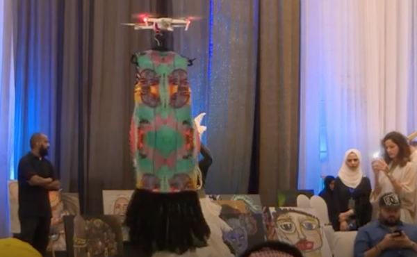 A drone flies a dress at a fashion show held in Jeddah, Saudi Arabia, as seen in a BBC Arabic report. A drone flies a dress at a fashion show held in Jeddah, Saudi Arabia, as seen in a BBC Arabic report.