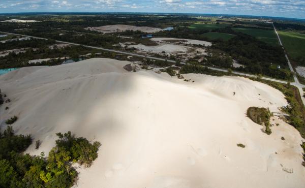 An aerial photo shows hills of mining waste known as "chat" scattered throughout the abandoned lead and zinc mine at the Tar Creek Superfund site. An aerial photo shows hills of mining waste known as "chat" scattered throughout the abandoned lead and zinc mine at the Tar Creek Superfund site.