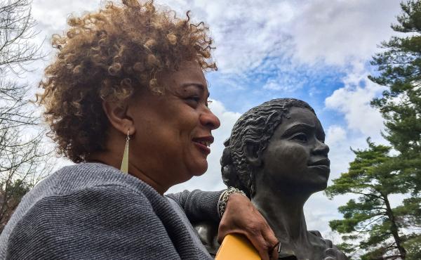 JerriAnne Boggis, executive director of the Black Heritage Trail of New Hampshire, poses with a monument that was erected in Harriet E. Wilson's honor. Boggis says when she read Wilson's book, she felt as if it was written the book just for her. JerriAnne Boggis, executive director of the Black Heritage Trail of New Hampshire, poses with a monument that was erected in Harriet E. Wilson's honor. Boggis says when she read Wilson's book, she felt as if it was written the book just for her.