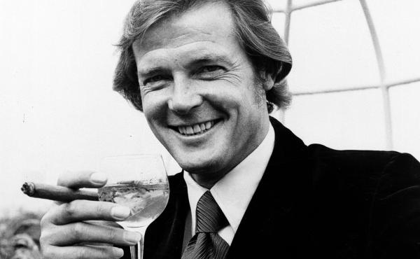 Actor Roger Moore, who played secret agent James Bond in the '70s and '80s, holds a martini. A new book written by a former CIA agent details how restaurants and cafes "are in many ways the lifeblood of espionage." Actor Roger Moore, who played secret agent James Bond in the '70s and '80s, holds a martini. A new book written by a former CIA agent details how restaurants and cafes "are in many ways the lifeblood of espionage."
