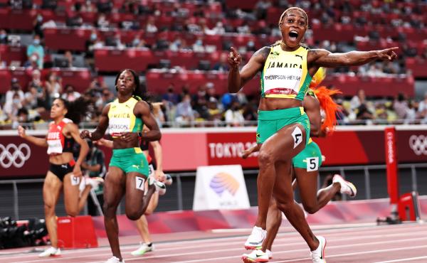 Elaine Thompson-Herah of Team Jamaica crosses the finish line to win the gold medal in the women's 100-meter final at the Tokyo Olympic Games on Saturday. Elaine Thompson-Herah of Team Jamaica crosses the finish line to win the gold medal in the women's 100-meter final at the Tokyo Olympic Games on Saturday.