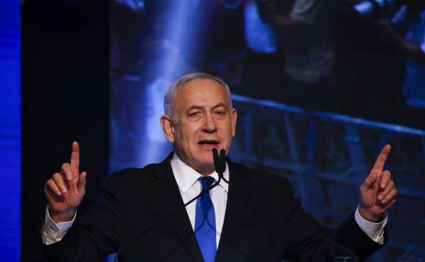Israeli Prime Minister Benjamin Netanyahu addresses his supporters at party headquarters after elections in Tel Aviv, Israel, on Wednesday. Israeli Prime Minister Benjamin Netanyahu addresses his supporters at party headquarters after elections in Tel Aviv, Israel, on Wednesday.