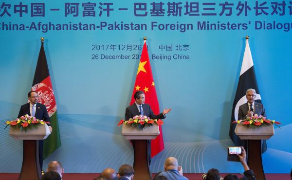 China's Foreign Minister Wang Yi (center), Afghanistan's Foreign Minister Salahuddin Rabbani (left) and Pakistan's Foreign Minister Khawaja Muhammad Asif (right) speak after the first China-Afghanistan-Pakistan Foreign Ministers' Dialogue in Beijing on De China's Foreign Minister Wang Yi (center), Afghanistan's Foreign Minister Salahuddin Rabbani (left) and Pakistan's Foreign Minister Khawaja Muhammad Asif (right) speak after the first China-Afghanistan-Pakistan Foreign Ministers' Dialogue in Beijing on De