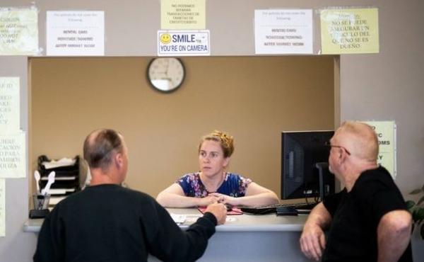 Clarisa Corber at work at a Topeka, Kan., insurance agency. Corber and her husband — who have three kids, a health plan and $15,000 in medical debt — were profiled in a recent Los Angeles Times investigation into the effects of high-deductible health Clarisa Corber at work at a Topeka, Kan., insurance agency. Corber and her husband — who have three kids, a health plan and $15,000 in medical debt — were profiled in a recent Los Angeles Times investigation into the effects of high-deductible health