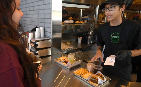 Shake Shack shortened managers' workweeks to four days at some stores a year and a half ago. Recently, the burger chain expanded the trial to a third of its U.S. stores. Shake Shack shortened managers' workweeks to four days at some stores a year and a half ago. Recently, the burger chain expanded the trial to a third of its U.S. stores.