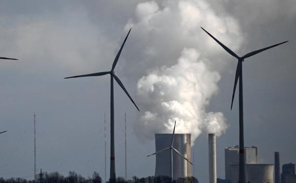 A new study finds that common climate change terms can be confusing to the public. That includes phrases that describe the transition from fossil fuels to cleaner sources of energy. Here, wind turbines operate near a coal-fired power plant in Germany. A new study finds that common climate change terms can be confusing to the public. That includes phrases that describe the transition from fossil fuels to cleaner sources of energy. Here, wind turbines operate near a coal-fired power plant in Germany.