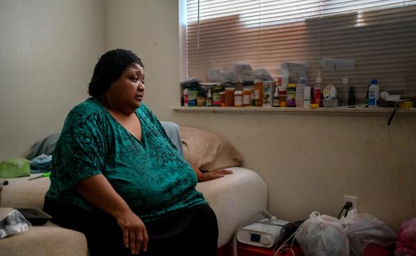 Wilma Banks, who lives in the neighborhood of New Orleans East, sits on her bed next to her nebulizer and CPAP machine. In the aftermath of Hurricane Ida, when much of New Orleans was left without power, she wasn't able to power up the medical devices and Wilma Banks, who lives in the neighborhood of New Orleans East, sits on her bed next to her nebulizer and CPAP machine. In the aftermath of Hurricane Ida, when much of New Orleans was left without power, she wasn't able to power up the medical devices and