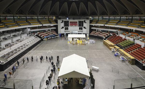 People queue to be tested for the coronavirus in a sports arena on Tuesday in Lyon, France. The World Health Organization said there were more than 700,000 new coronavirus cases reported in Europe last week. People queue to be tested for the coronavirus in a sports arena on Tuesday in Lyon, France. The World Health Organization said there were more than 700,000 new coronavirus cases reported in Europe last week.