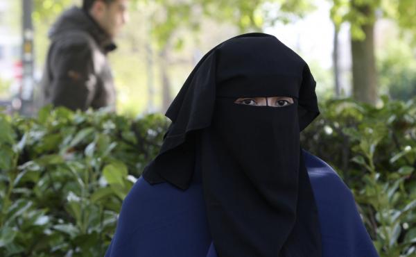 A young woman wears the niqab, or full face veil, as she sits in a park in Brussels in 2010. On Tuesday, the European Court of Human Rights upheld Belgium's 2011 ban on wearing partial or full face veils in public. A young woman wears the niqab, or full face veil, as she sits in a park in Brussels in 2010. On Tuesday, the European Court of Human Rights upheld Belgium's 2011 ban on wearing partial or full face veils in public.