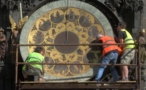 Members of the European Parliament have voted to abolish daylight saving time in the EU. Here, workers remove the calendar dial of Prague's astronomical clock during a renovation of the building in 2017. Members of the European Parliament have voted to abolish daylight saving time in the EU. Here, workers remove the calendar dial of Prague's astronomical clock during a renovation of the building in 2017.