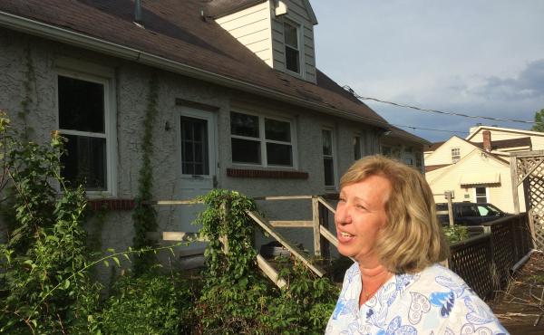 The house next door to Maureen and Michael McCabe has been sitting empty for seven years. "It freaks me out," Maureen McCabe says. "I don't know if there's animals running around there, mice and rodents." The house next door to Maureen and Michael McCabe has been sitting empty for seven years. "It freaks me out," Maureen McCabe says. "I don't know if there's animals running around there, mice and rodents."