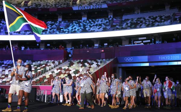 Flag bearers Phumelela Luphumlo Mbande and Chad Le Clos of Team South Africa lead their team out during the opening ceremony of the Tokyo Olympic Games on Friday. Flag bearers Phumelela Luphumlo Mbande and Chad Le Clos of Team South Africa lead their team out during the opening ceremony of the Tokyo Olympic Games on Friday.