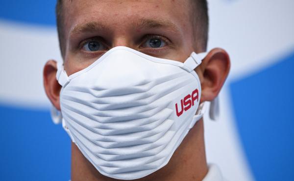 Team USA's Caeleb Dressel wears a USA-branded face covering while waiting to receive his gold medal after the final of the men's 4x100 meter freestyle relay swimming event during the Tokyo Olympics at the Tokyo Aquatics Centre on Monday. Team USA's Caeleb Dressel wears a USA-branded face covering while waiting to receive his gold medal after the final of the men's 4x100 meter freestyle relay swimming event during the Tokyo Olympics at the Tokyo Aquatics Centre on Monday.