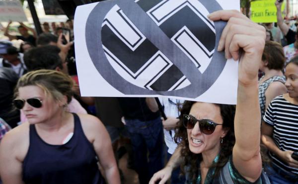 Protesters shout anti-Nazi chants after chasing alt-right blogger Jason Kessler from a news conference on Aug. 13 in Charlottesville. Protesters shout anti-Nazi chants after chasing alt-right blogger Jason Kessler from a news conference on Aug. 13 in Charlottesville.
