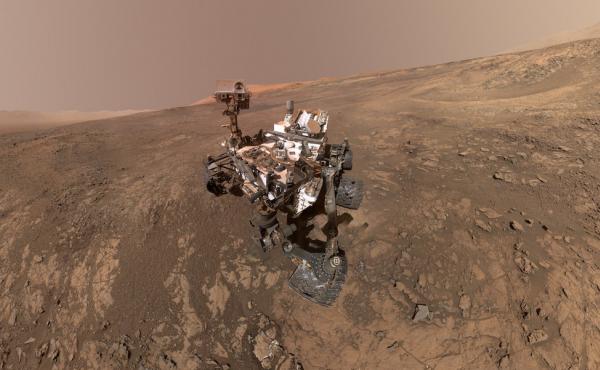 NASA's rover Curiosity crawls up the side of Vera Rubin Ridge on Mars' surface in January 2018. Mount Sharp — a 3-mile-high mountain — can be seen in the distance. NASA's rover Curiosity crawls up the side of Vera Rubin Ridge on Mars' surface in January 2018. Mount Sharp — a 3-mile-high mountain — can be seen in the distance.