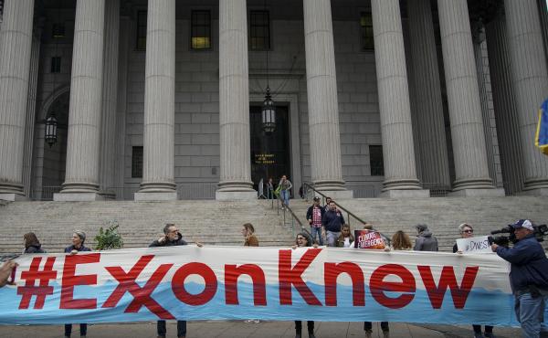Environmental activists rally outside of New York Supreme Court in October in Manhattan, the first day of the trial accusing ExxonMobil of misleading shareholders about its climate change accounting. Environmental activists rally outside of New York Supreme Court in October in Manhattan, the first day of the trial accusing ExxonMobil of misleading shareholders about its climate change accounting.