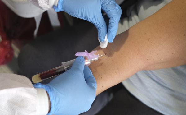 Deputy Chief Patricia Cassidy of the Jersey City Police Department has blood drawn to test for coronavirus antibodies in Jersey City, N.J., on Monday. Deputy Chief Patricia Cassidy of the Jersey City Police Department has blood drawn to test for coronavirus antibodies in Jersey City, N.J., on Monday.