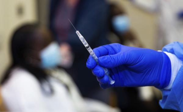 A doctor prepares to administer a vaccine injection at New York-Presbyterian Lawrence Hospital in Bronxville, N.Y., in January. The Food and Drug Administration has approved emergency use authorization of the Pfizer/BioNTech vaccine for patients ages 12 t A doctor prepares to administer a vaccine injection at New York-Presbyterian Lawrence Hospital in Bronxville, N.Y., in January. The Food and Drug Administration has approved emergency use authorization of the Pfizer/BioNTech vaccine for patients ages 12 t
