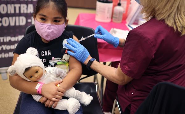 First grader Rihanna Chihuaque, 7, receives a COVID-19 vaccine at Arturo Velasquez Institute in Chicago last November. First grader Rihanna Chihuaque, 7, receives a COVID-19 vaccine at Arturo Velasquez Institute in Chicago last November.